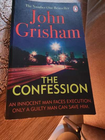 John Grosham book almost new - Fictional books