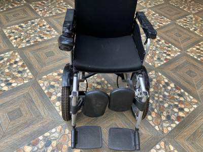recent electrical wheel chair - Wheelchair